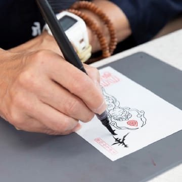 卒業生へ感謝を込めた「御朱印浄書」